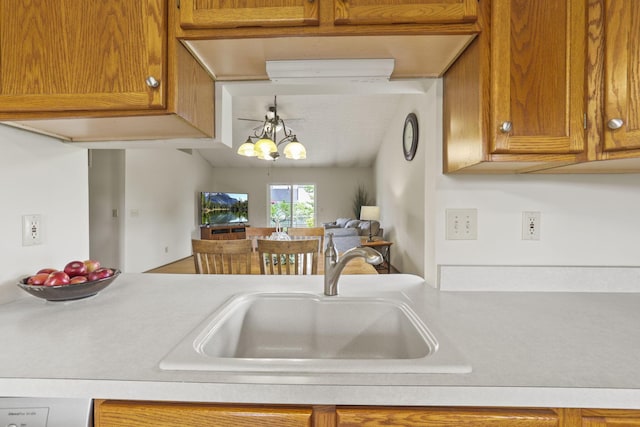 kitchen featuring pendant lighting, sink, and ceiling fan