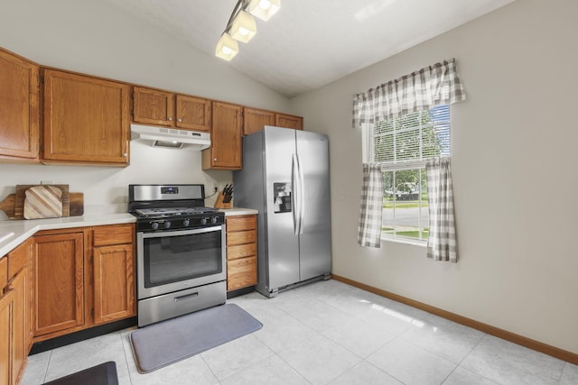 kitchen featuring lofted ceiling and appliances with stainless steel finishes