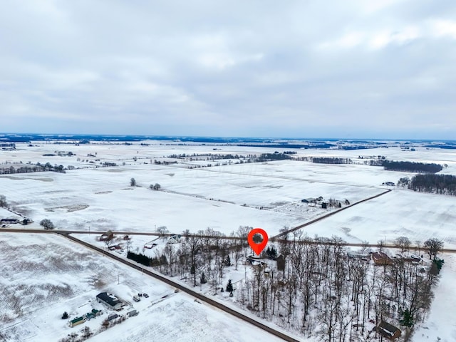 snowy aerial view with a rural view