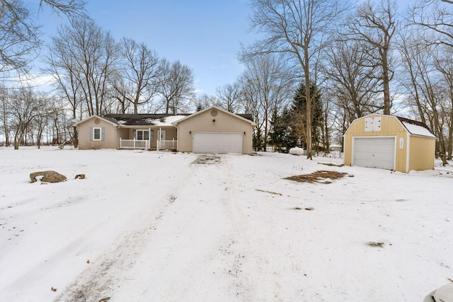 view of front facade with an outbuilding and a detached garage