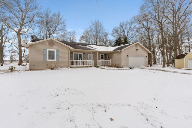 single story home featuring a porch and an attached garage