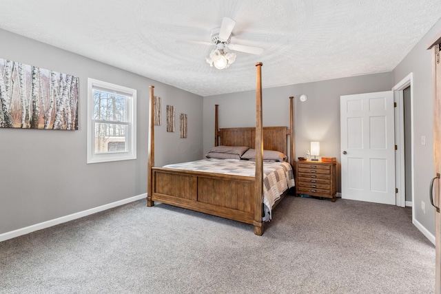 bedroom with baseboards, ceiling fan, a textured ceiling, and light colored carpet