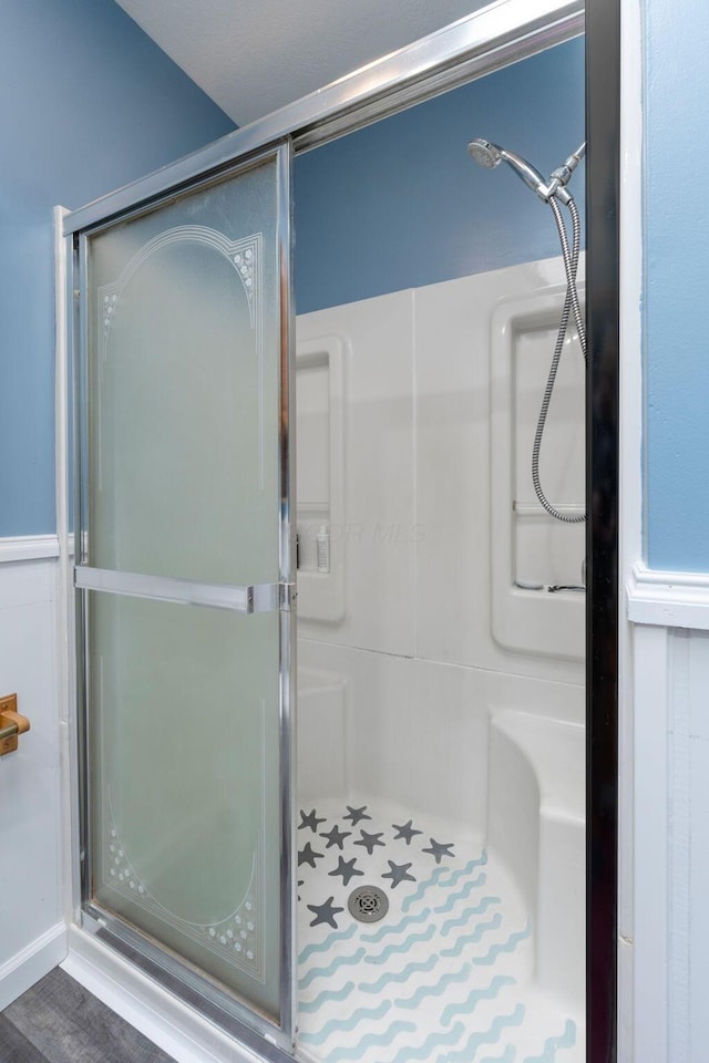 full bath with a shower with door