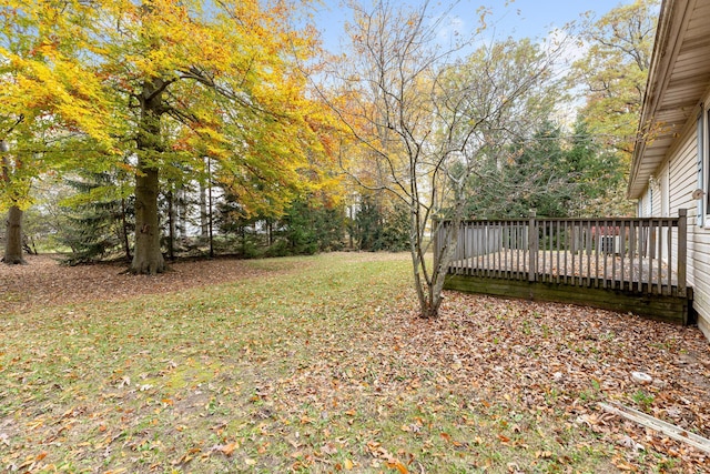 view of yard featuring a wooden deck