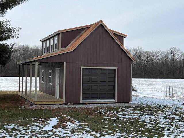 view of snow covered garage