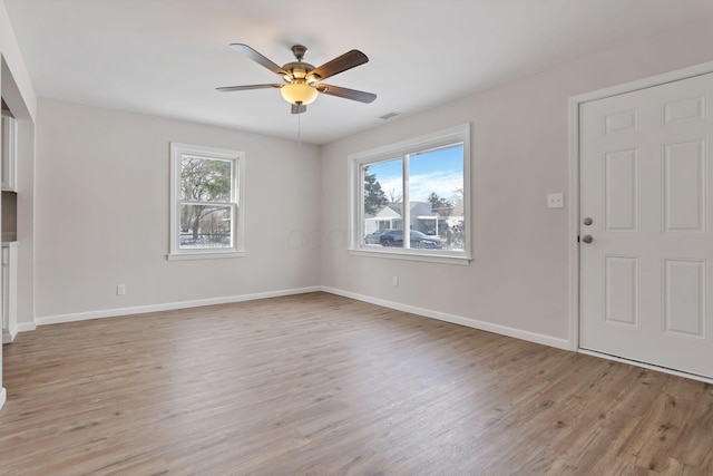 interior space with ceiling fan and light wood-type flooring