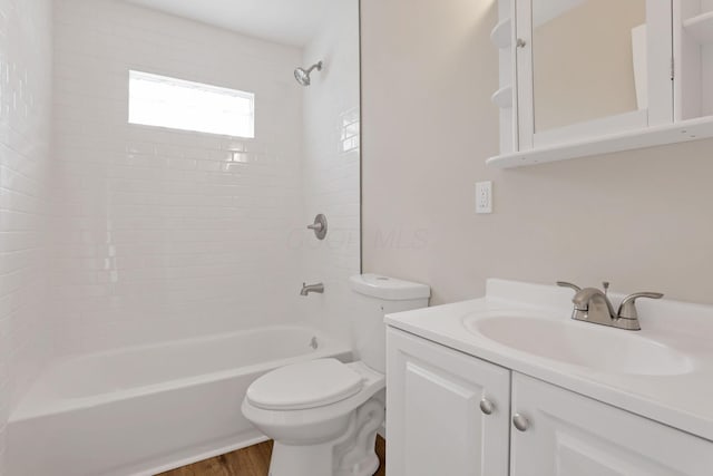 full bathroom with hardwood / wood-style flooring, vanity, toilet, and bathtub / shower combination