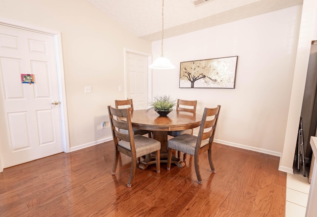 dining room with hardwood / wood-style floors