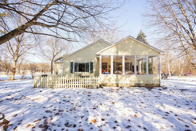 view of front of house featuring a sunroom