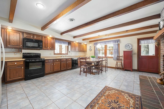 kitchen featuring sink, black appliances, light tile patterned flooring, decorative light fixtures, and beamed ceiling