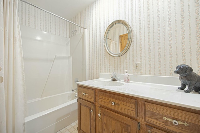 bathroom featuring vanity and shower / bathtub combination with curtain