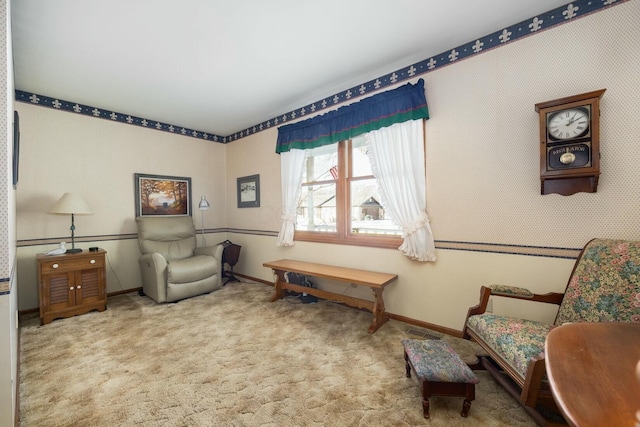 sitting room featuring light carpet