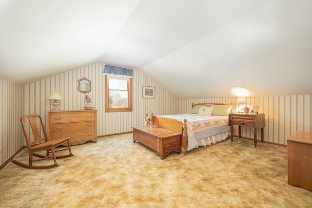 bedroom with vaulted ceiling and light carpet