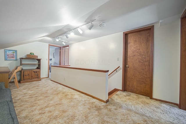 interior space with lofted ceiling and light colored carpet