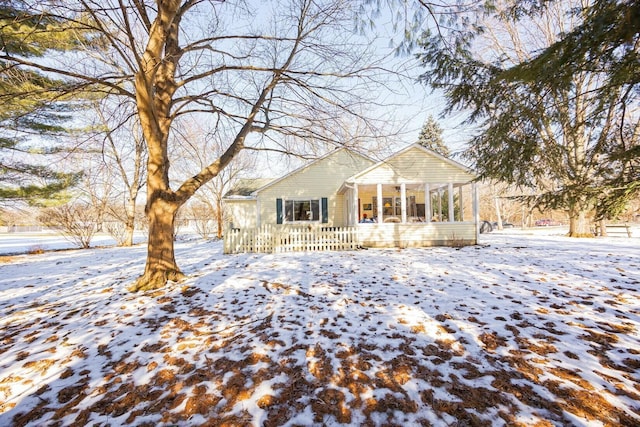 view of front facade with a sunroom