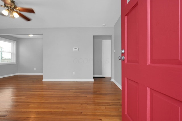 entrance foyer with wood-type flooring and ceiling fan