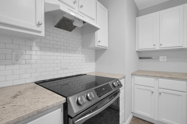 kitchen featuring tasteful backsplash, stainless steel electric range, and white cabinets