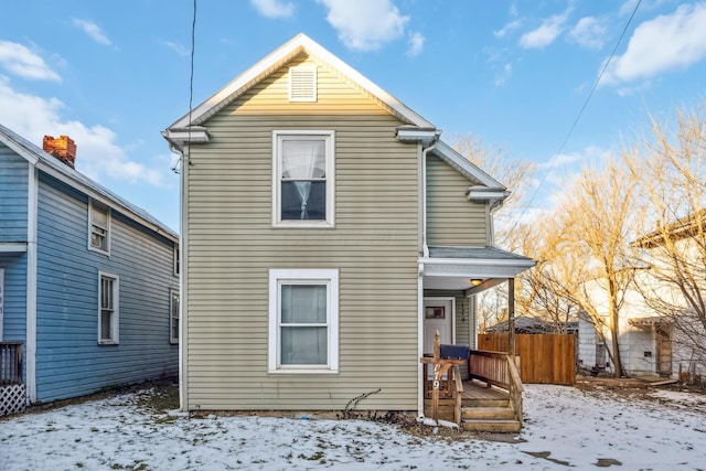 view of snow covered house