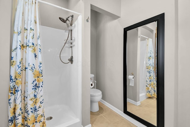 bathroom with tile patterned flooring, toilet, and a shower with shower curtain