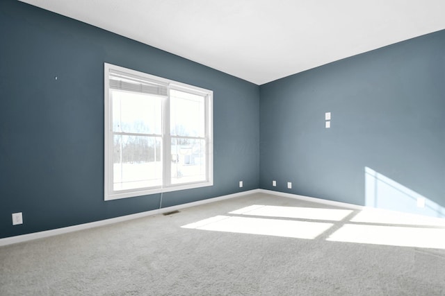 unfurnished room with carpet flooring