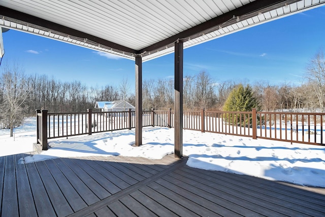 view of snow covered deck