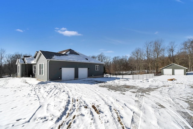 exterior space featuring a garage and an outdoor structure