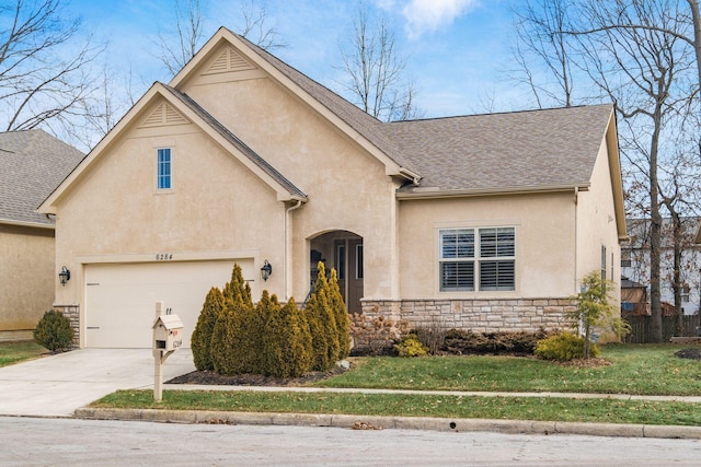 view of front of property featuring a garage and a front yard