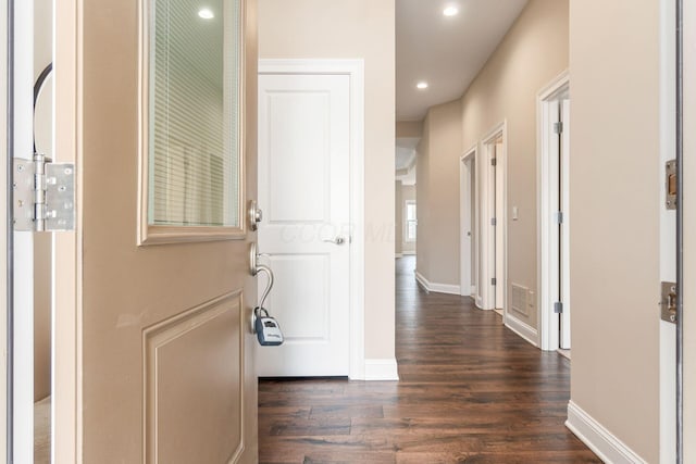 corridor featuring dark hardwood / wood-style floors