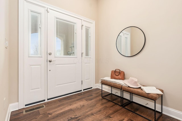 foyer entrance with dark hardwood / wood-style flooring