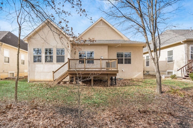 back of house featuring a deck