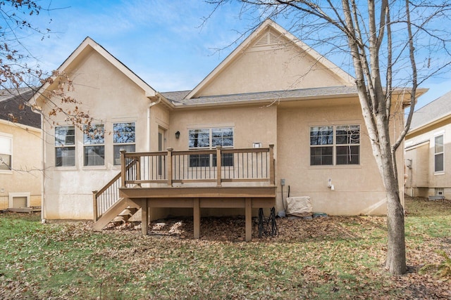 rear view of property with a wooden deck