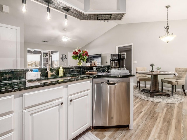 kitchen with sink, white cabinetry, vaulted ceiling, dishwasher, and light hardwood / wood-style floors