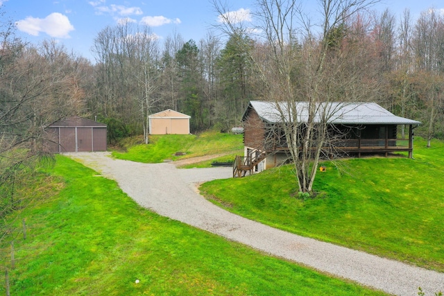 surrounding community featuring a yard and an outdoor structure