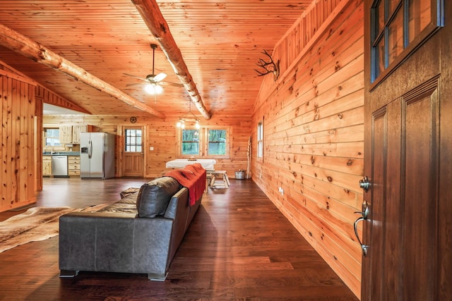 living room with wood walls, lofted ceiling with beams, dark hardwood / wood-style flooring, ceiling fan, and wood ceiling