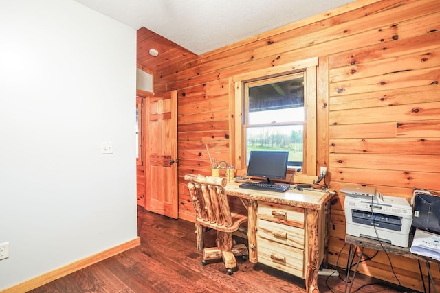 home office with wooden walls and dark hardwood / wood-style flooring