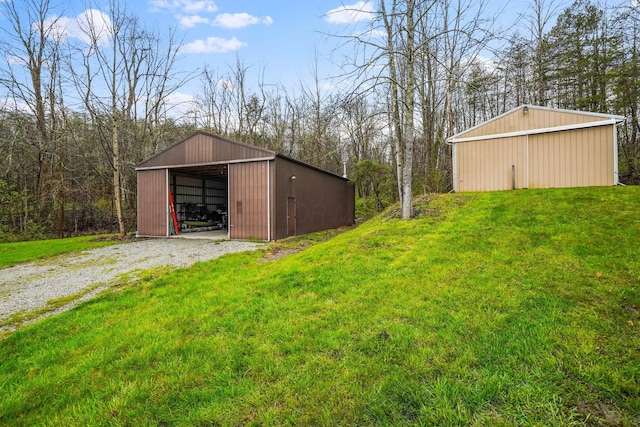 view of outbuilding with a yard