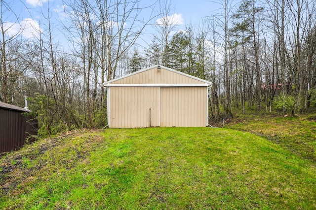 view of outbuilding with a yard