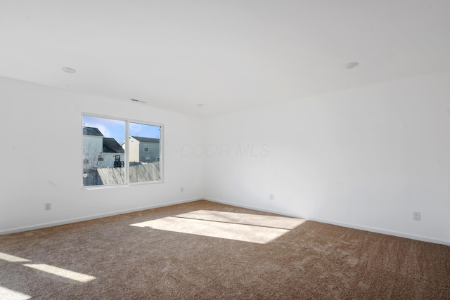 unfurnished room featuring carpet floors