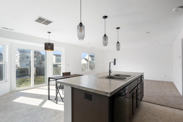 kitchen with decorative light fixtures, an island with sink, dishwasher, sink, and dark brown cabinetry