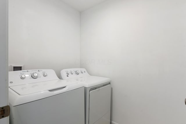 washroom featuring separate washer and dryer