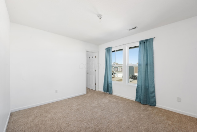 spare room featuring carpet flooring