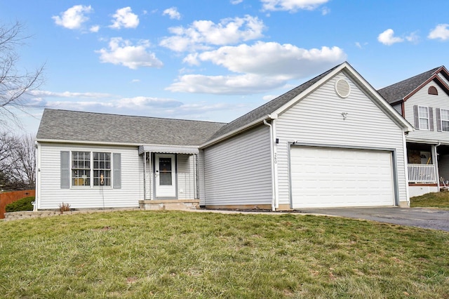 ranch-style house with a garage and a front yard