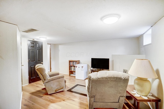 living room with light hardwood / wood-style floors