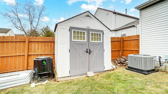 view of outdoor structure with a yard and cooling unit