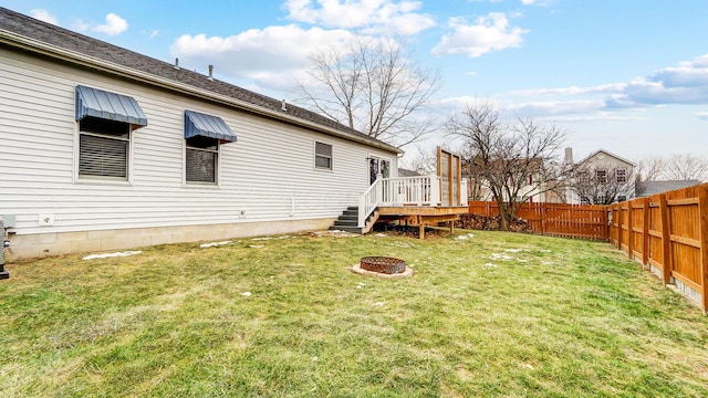 view of yard featuring a wooden deck and an outdoor fire pit