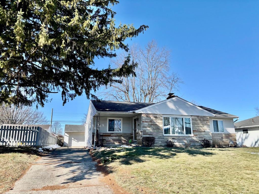 view of front of property with a garage and a front yard