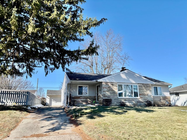 view of front of property with a garage and a front yard