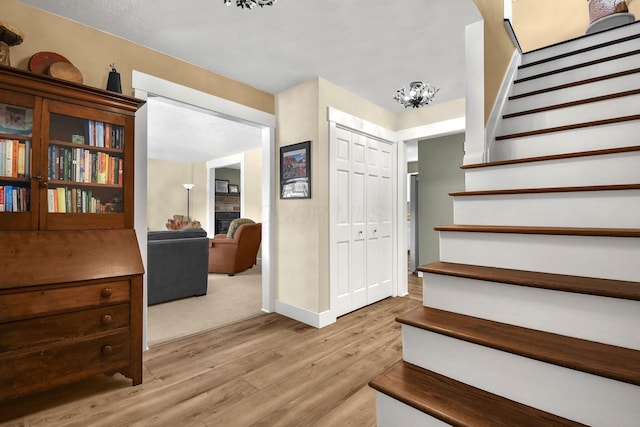 stairs with hardwood / wood-style floors