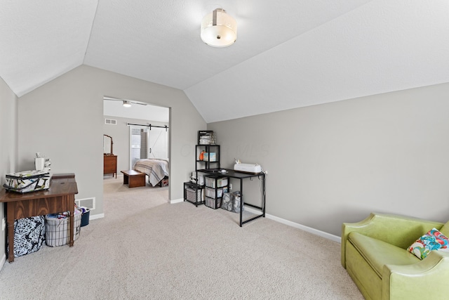 living area featuring vaulted ceiling, visible vents, carpet floors, and baseboards