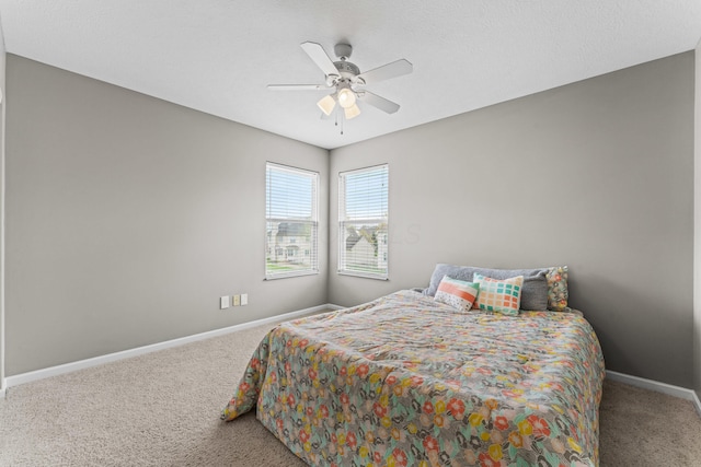 bedroom with baseboards, carpet floors, and ceiling fan